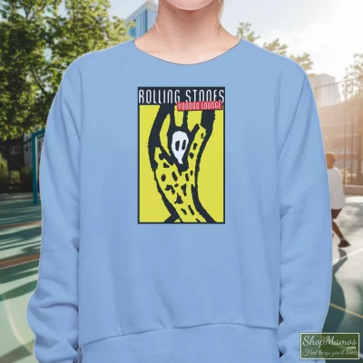 Women's Rolling Stones 1994 - 1995 Voodoo Lounge Concert Tour Sweatshirt In Light Blue, Front View On Dark Wood Background