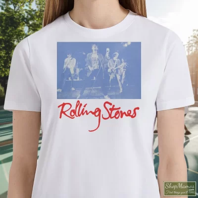 Women's Rolling Stones Black And Blue Live T Shirt In White, Front View On Dark Wood Background