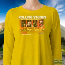Rolling Stones Licks World Tour Shirt 9 Women's Rolling Stones Licks World Tour Long Sleeve In Yellow, Front View On Dark Wood Background