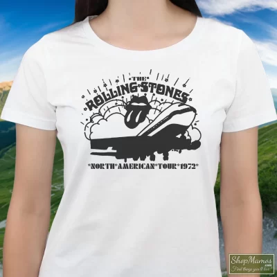 Women's Rolling Stones North American Concert Tour 1972 T Shirt In White, Front View On Dark Wood Background