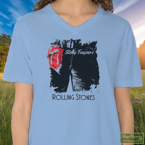 Rolling Stones Sticky Fingers Women’s V Neck – Light Blue Front View On Dark Wood Background Women's Rolling Stones Sticky Fingers V Neck In Light Blue, Front View On Dark Wood Background