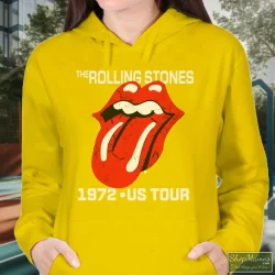 Rolling Stones Tongue 1972 US Tour Shirt 2 Women's Rolling Stones Tongue 1972 US Tour Hoodie In Yellow, Front View On Dark Wood Background