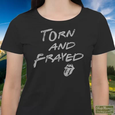 Women's Rolling Stones Torn And Frayed T Shirt In Black, Front View On Light Wood Background