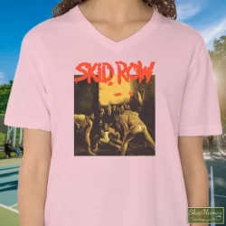 Skid Row 1991 Slave To The Grind Tour Shirt 2 Women's Skid Row 1991 Slave To The Grind Tour V Neck In Light Pink, Front View On Dark Wood Background