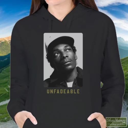 Snoop Dogg Unfadeable Women’s Hoodie – Black Front View On Light Wood Background Women's Snoop Dogg Unfadeable Hoodie In Black, Front View On Light Wood Background