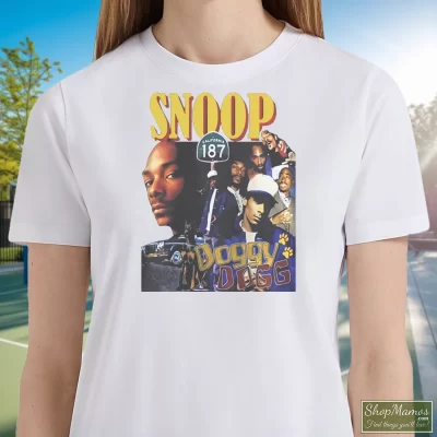 Women's Snoop Doggy Dogg T Shirt In White, Front View On Dark Wood Background