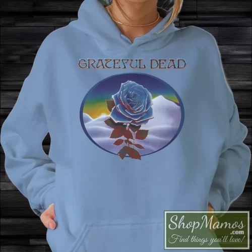 Rare Stanley Mouse Blue Rose Grateful Dead Women’s Hoodie – Light Blue Front View on Dark Wood Background Women's Rare Stanley Mouse Blue Rose Grateful Dead Hoodie in Light Blue, front view on dark wood background
