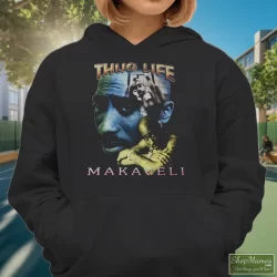 Tupac Shakur 2pac Thug Life One Year In Memory Memorial Shirt 10 Women's Tupac Shakur 2pac Thug Life One Year In Memory Memorial Hoodie In Black, Front View On Light Wood Background