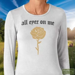 Tupac Shakur All Eyez On Me New Era Shirt 3 Women's Tupac Shakur All Eyez On Me New Era Long Sleeve In White, Front View On Dark Wood Background
