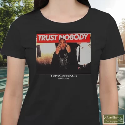 Women's Tupac Shakur Trust Nobody Graphic T Shirt In Black, Front View On Light Wood Background