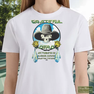 Women's Vintage 1977 Grateful Dead Manor Downs Concert T Shirt In White, Front View On Dark Wood Background
