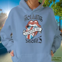 Vintage Rolling Stones Europe 82 Shirt 9 Women's Vintage Rolling Stones Europe 82 Hoodie In Light Blue, Front View On Dark Wood Background