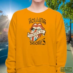Vintage Rolling Stones Europe 82 Shirt 5 Women's Vintage Rolling Stones Europe 82 Sweatshirt In Orange, Front View On Dark Wood Background