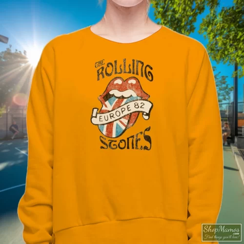 Vintage Rolling Stones Europe 82 Women’s Sweatshirt – Orange Front View On Dark Wood Background Women's Vintage Rolling Stones Europe 82 Sweatshirt In Orange, Front View On Dark Wood Background
