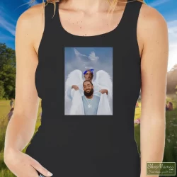 Two Angels Tupac Shakur And Nipsey Hussle Shirt 3 Women's Two Angels Tupac Shakur And Nipsey Hussle Tank Top In Black, Front View On Light Wood Background